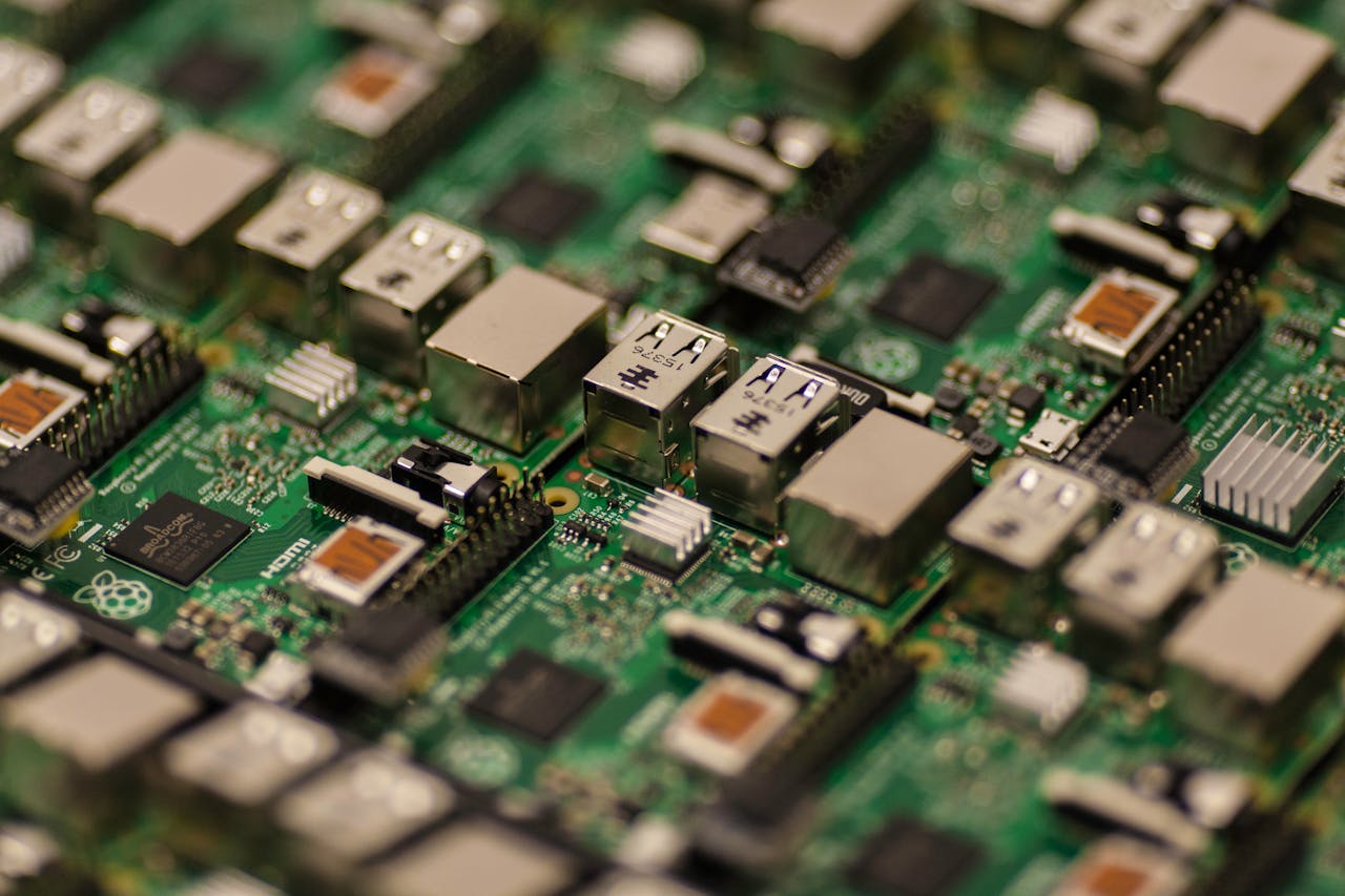 Services-01 Detailed shot of a Raspberry Pi circuit board showcasing its components, USB ports, and microchips.
